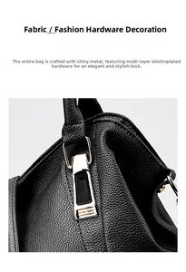 Macro detail of black litchi leather handbag with premium gold-plated metal hardware