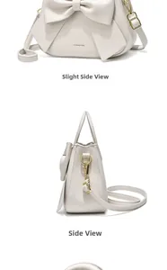 Detail view of cream shoulder bag featuring an oversized bow and sleek gold metal hooks