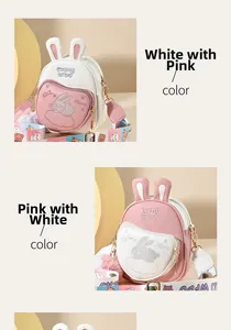 Detail of cute rabbit ear crossbody bag featuring bunny embroidery and colorful strap