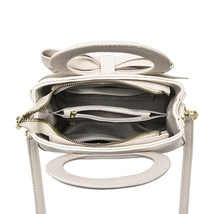 Beige PU leather crossbody bag with circular cutout handle and multi-layer interior