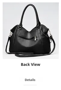 Close-up of black lychee leather handbag showing the back zipper pocket and gold hardware