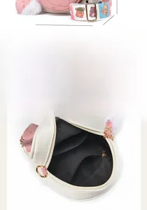 Detail view of compact crossbody bag with 16cm length and organized inner compartments