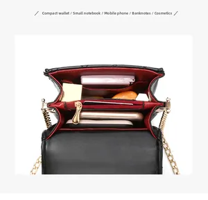 Internal view showing red lining and multi-compartment structure of the quilted bag