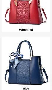 Details von weinroten und blauen Ledertaschen mit floraler Prägung und Schal-Griffen
