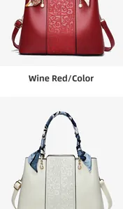 Detail of red and cream handbags with embossed patterns and decorative silk scarves