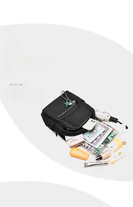 Top view of large capacity waterproof black nylon backpack with various travel essentials