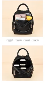 Internal structure of black lychee leather backpack showing multi-pocket storage capacity