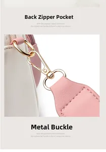 Detail of pink and white leather bag with gold hardware buckle and back zipper pocket
