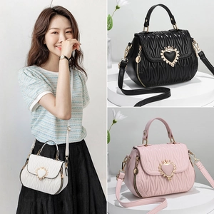 Chic pleated bucket bag with heart buckle in black, pink, and white color options
