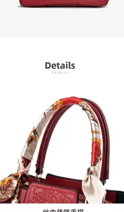 Detail of red wedding handbag with floral embroidery and silk scarf wrapped handle