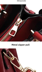 Detail of red bridal leather bag featuring gold zipper hardware and luxury texture