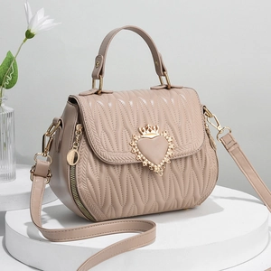 Chic beige quilted crossbody bag with heart crown buckle and top handle for women