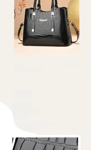 Close-up of black crocodile pattern leather texture and golden metal buckle of handbag
