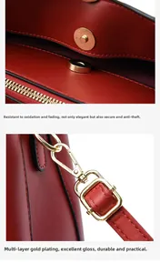 Detail der roten Ledertasche mit goldener Magnetschnalle und hochwertigen Beschlägen