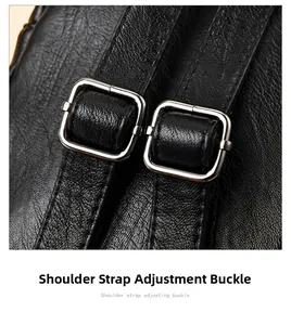 Detail of adjustable shoulder strap with silver buckle on black leather backpack