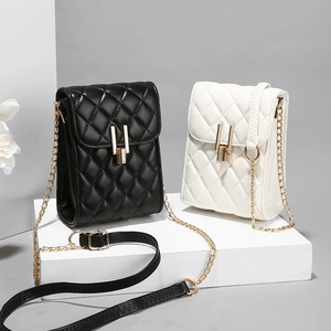 Quilted mini crossbody bag with gold U-shape lock and chain strap in black and beige