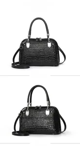 Front and side views of black snakeskin texture handbag with silver hardware and dual zippers