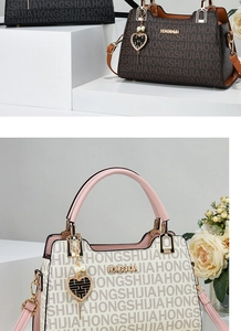 Macro detail of high-capacity tote bag with monogram texture and metal logo plaque