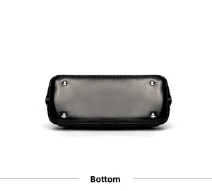 Detailed bottom view of large snakeskin texture handbag with silver protective metal feet