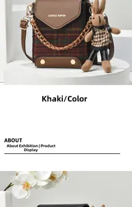 Detail of vintage khaki mini crossbody bag with plaid pattern and cute rabbit charm