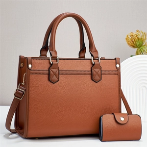 Brown faux leather tote bag and card holder set with adjustable strap and gold hardware
