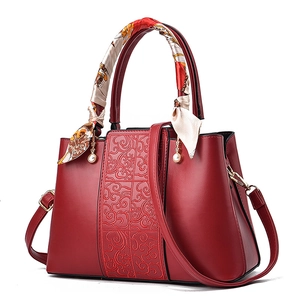 Elegant red wedding handbag with cloud pattern texture and silk scarf wrapped handle