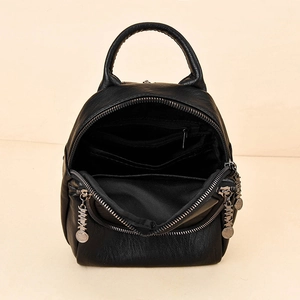 Women's black leather mini backpack with silver double zippers and internal storage view