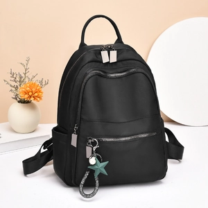 Waterproof black nylon backpack for women with star pendant and multiple zipper pockets