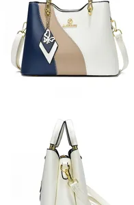 Vues de face et de côté d'un sac à main contrasté avec pendentif papillon doré élégant
