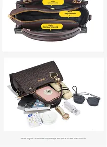 Detailed internal view of brown leather handbag with three main storage compartments