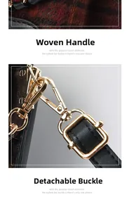 Detail of woven handle and detachable gold metal clasp on a black leather handbag