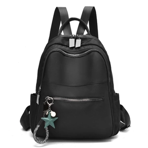 Waterproof black nylon backpack for women with decorative star pendant and pearl detail