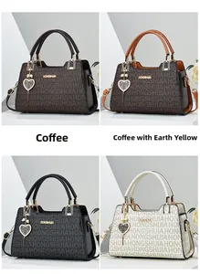 Detail view of printed leather handbags with heart charms in coffee, black and white colors