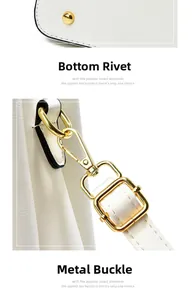 Détails du sac à main blanc avec rivets de protection et mousquetons dorés polis