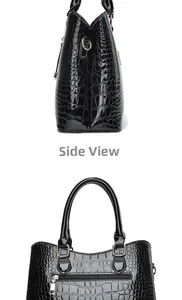 Side view of black crocodile pattern handbag with glossy finish and gold metal hardware