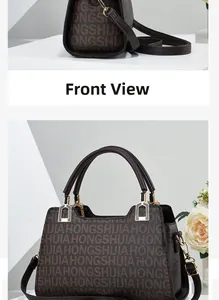 Detail view of large capacity brown printed handbag with golden hardware and leather handles