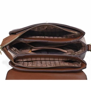 Deep brown crossbody bag with multi-compartment interior and striped fabric lining