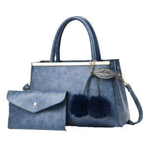 Blue textured PU leather tote bag set with matching clutch and plush cherry pendant