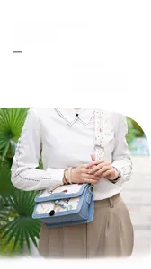 Detail view of light blue crossbody bag featuring Eiffel Tower prints and geometric strap