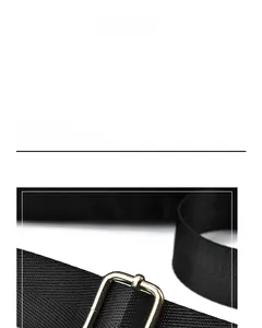 Detail of adjustable gold-tone metal buckle on black waterproof nylon shoulder strap
