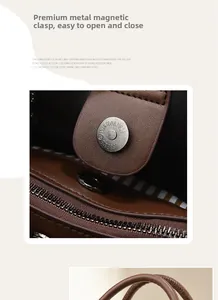 Detail of magnetic silver snap closure and textured litchi leather on tote bag