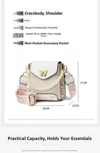 Detail view of cream crocodile-embossed crossbody bag with pearl strap and wide woven belt