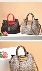 Detail of elegant handbag showing textured leather and stylish braided handles