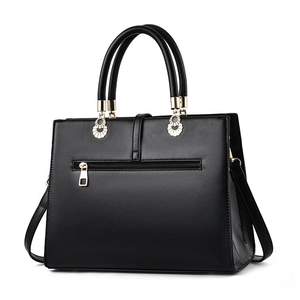 Black woven large capacity crossbody bag with gold hardware and dual handles