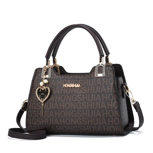 Large brown monogram tote bag with double handles and heart pearl charm for women