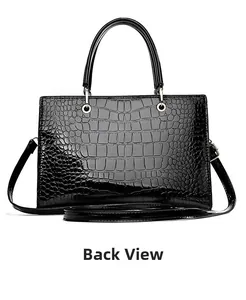 Detailed back view of black crocodile pattern tote bag with polished finish and gold rings