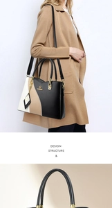 Detail of color-block tote bag with gold hardware and elegant butterfly charm