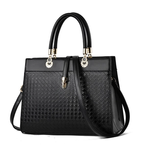Fashionable black woven leather handbag for women with gold hardware and shoulder strap