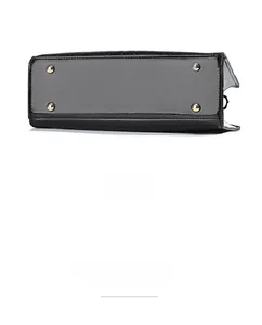 Detail view of the black crocodile pattern handbag base with four golden metal feet
