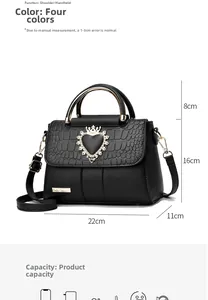 Detail view of crocodile-patterned handbag with heart crown buckle and size annotations